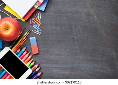 School and office supplies on blackboard background. Top view with copy space - Powered by Shutterstock