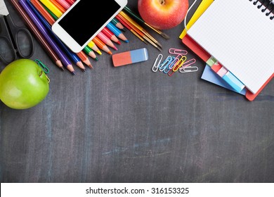 School and office supplies on blackboard background. Top view with copy space - Powered by Shutterstock