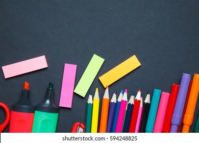 School And Office Supplies On Blackboard Background.