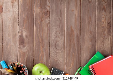 School And Office Supplies On Classroom Table. Top View With Copy Space