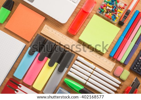 School office supplies on a desk 

