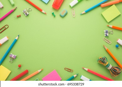 School office supplies on a green background  - Shutterstock ID 695338729