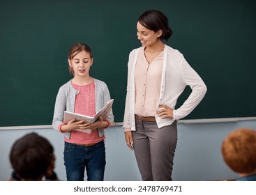 School, presentation and teacher with girl for book, reading or communication skills assessment. Classroom, exam and woman with kid for public speaking, speech or learning and storytelling support - Powered by Shutterstock