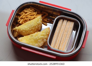 School snack box with healthy goodies, waffle, Kanraji and shev, Indian snack - Powered by Shutterstock