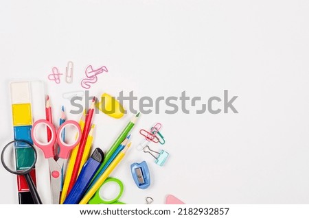 School stationery on white background. Supplies for studying at school. Flatlay,  mock up. Frame of colorful stationery. Back to school concept. 