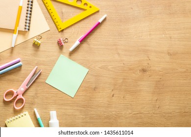 School Stationery On A Wooden Background. Back To School Concept. Flat Lay Style Composition, Top View, Overhead. 