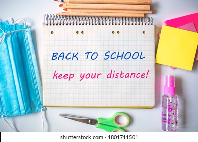 School Stationery Supplies, Medical Masks And Hand Gel Sanitizer, Keep Your Distance, School Reopening, Returning Back To School For Post Covid-19 Coronavirus Pandemic, New Normal Concept 