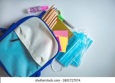 School Stationery Supplies, Medical Masks And Hand Gel Sanitizer, Keep Your Distance, School Reopening, Returning Back To School For Post Covid-19 Coronavirus Pandemic, New Normal Concept 