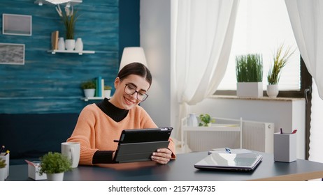 School Student Using Digital Tablet To Work On Class Assignment, Doing Remote University Work From Home. Person Learning To Take Notes Online Lesson Notes On Device With Stylus.