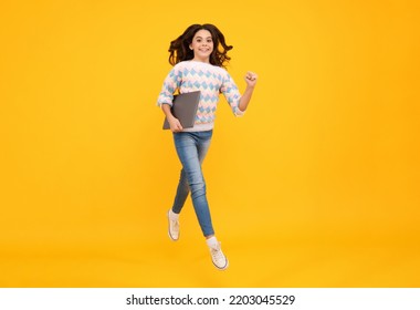 School Student Using Laptop. E-learning And Online Education. Run And Jump, Jumping Kids. Teen Girl On Internet Video Chat Isolated On Isoalted Studio Background.