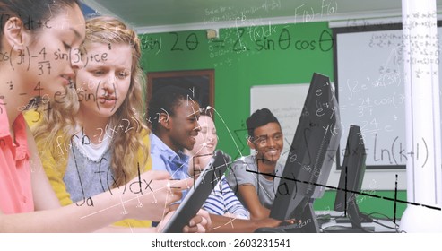 In school, students using computers collaborating on math project, staying engaged. Education, teamwork, collaboration, technology, learning, classroom
