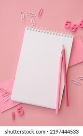 School supplies accessories stationery on pink background, flat lay, top view. Education supply accessory open empty notebook stuff. Back to school concept. Flatlay from above. Vertical copy space. - Shutterstock ID 2197444533