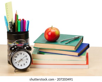 School Supplies And Alarm Clock On Table Isolated On White