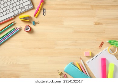 School supplies frame on wooden desk. Top view. Flat lay. - Powered by Shutterstock