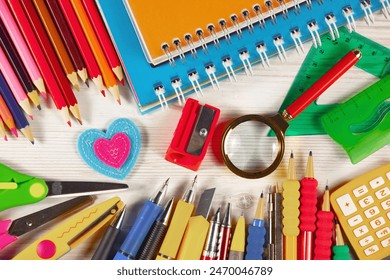 School supplies are laid out in a composition on a light background. Back to school. - Powered by Shutterstock