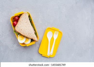 School Supplies And Lunch Box With Sandwich And Vegetables. Back To School. Healthy Eating Habits Concept - Background Layout With Free Text Space. Flat Lay Composition, Mockup, Top View