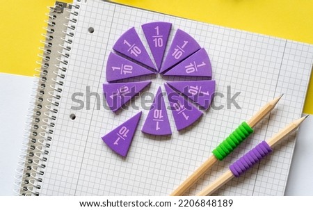 School supplies, math fractions, pencils, pencils on yellow background. Back to school, education concept background	