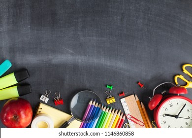 School supplies on black board background. Back to school concept - Shutterstock ID 1146860858