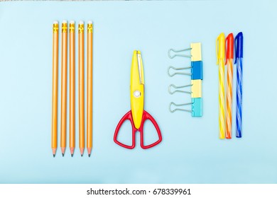 School Supplies On Blue Background. Flat Lay