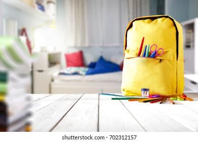 School Supplies On A Wooden Table In A Warm Interior