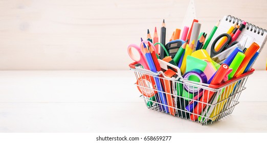 School Supplies In A Shopping Basket On White Background