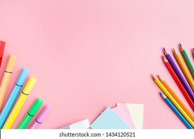 School Supplies Stationery, Colour Pencils, Paints, Paper On Pink Background, Back To School Concept With Free Copy Space For Text, Modern Elementary Education. Kids Desk, Flat Lay, Top View, Mockup.