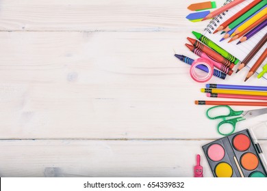 School supplies, stationery on white background - space for caption, top view - Powered by Shutterstock