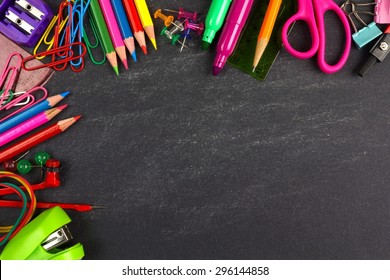 School Supplies Top Corner Border On A Chalkboard Background