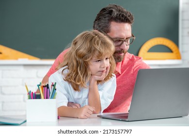 School teacher with a schoolboy learning at laptop computer, studying with online education. Teacher and students in the classroom. Teacher helping child student pupil from elementary school. - Shutterstock ID 2173157797