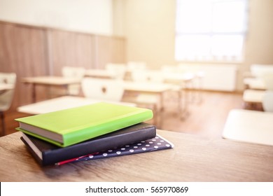 School Teacher's Desk With Stack Of Books