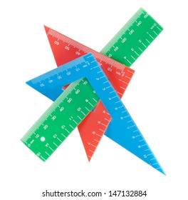 School tools multicolored triangle, ruler, protractor. Close-up.