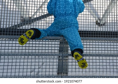 School Trip, Falling From Metal Stairs In Winter Glides Dangerously. A Little Boy In Winter Boots Fell And Lay Injured On The Stairs. Legs Broken Twisted Danger Of Falling, Stun Baby, Children Blue 