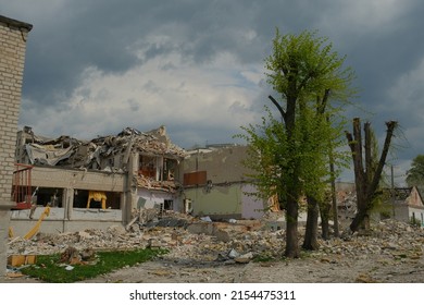 A school in the Ukrainian city of Zhytomyr was destroyed after a Russian ballistic missile hit. Russian aggression concept. Dramatic sky background.