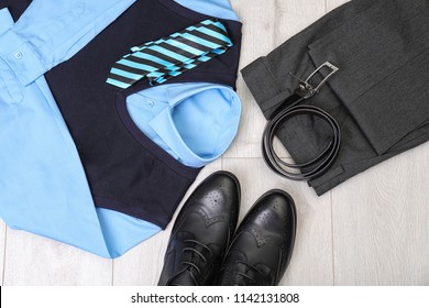 School Uniform For Boy On Laminate, Top View