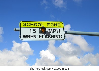 School Zone 15 MPH When Flashing traffic sign