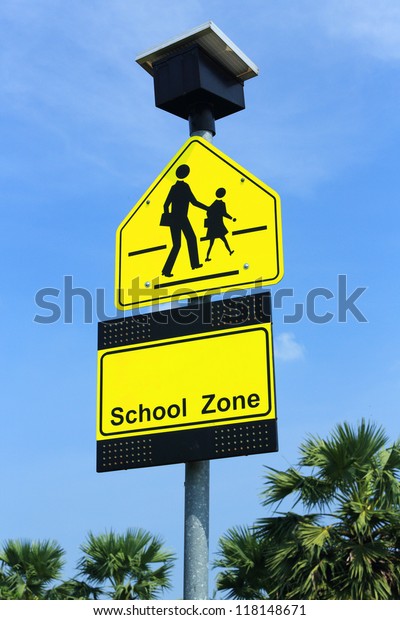 School zone sign, drive slowly and be careful\
student walking cross the\
road
