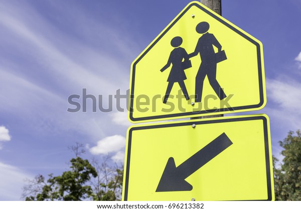 school zone sign in\
front of a blue sky