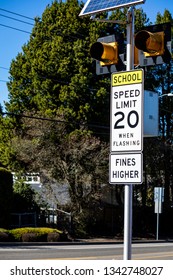 School Zone Speed Limit Sign In Front Of Trees