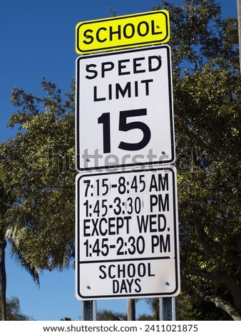 School zone speed limit sign in Miami, Florida (Speed limit: 15 miles-per-hour). 