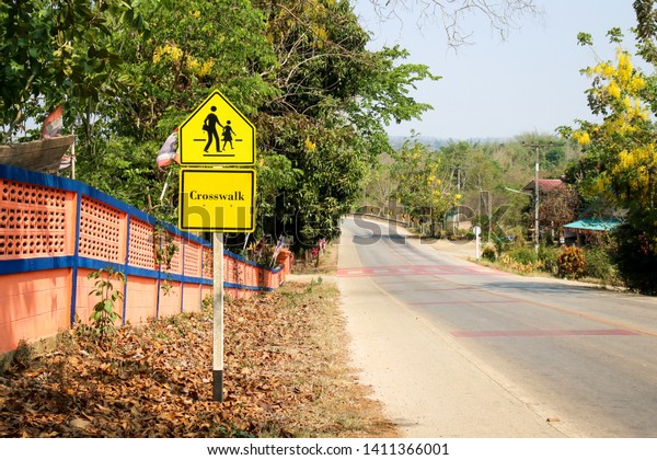 School zone warning and\
crosswalk sign.