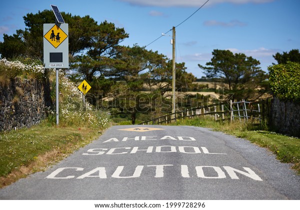 School zone warning sign on\
traffic