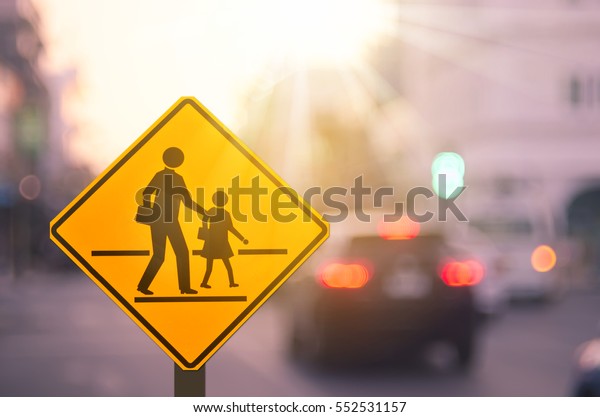 School
zone warning sign on blur traffic road with colorful bokeh light
abstract background. Copy space of transportation and travel
concept. Vintage tone filter effect color
style.