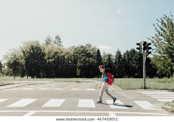 Schoolboy Crossing Road On Way School Stock Photo Edit Now