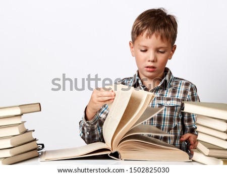 Similar – boy reading books