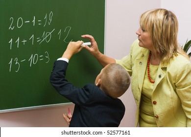 The schoolboy solves examples at a mathematics lesson