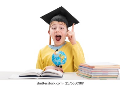 Schoolboy In Student Hat Raised Index Finger Up Over White Background. Concept Idea Or Insight In Child. Excellent Student.