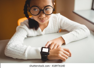 Schoolchild wearing a smart watch at school - Powered by Shutterstock