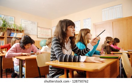 Schoolchildren during lesson in classroom.