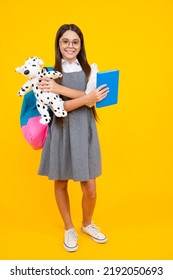 Schoolgirl 12, 13, 14 years old with toy. School children cuddling favorite toys on yellow background. Happy childhood. - Shutterstock ID 2192050693