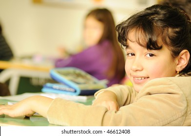  schoolgirl with a book in the living room - Shutterstock ID 46612408